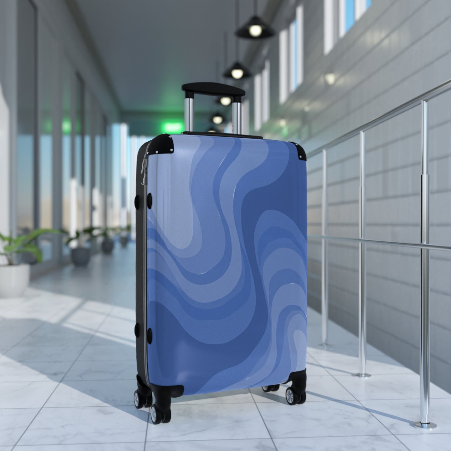 Deep Blue Wavey Medium Suitcase with built in lock, 4 double-wheels, telescopic handle, and ABS back hard-shell
