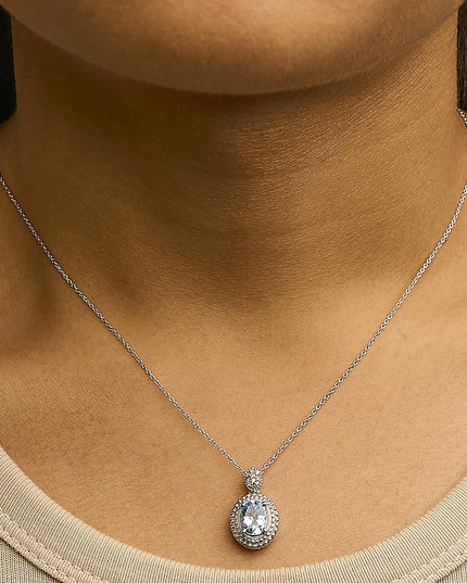 .925 Sterling Silver Oval Blue Topaz and Diamond Accent with Beaded Halo Pendant Necklace - 18" Inches